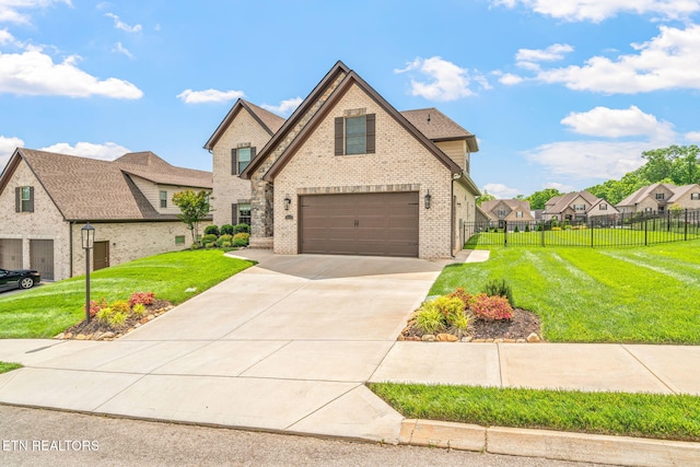 9337 Sandy Springs Ln, Knoxville, TN 37922 - view of front of home with brick siding, a garage, and driveway