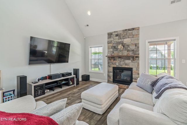 9337 Sandy Springs Ln, Knoxville, TN 37922 - living area featuring wood finished floors, a stone fireplace, high vaulted ceiling, and baseboards