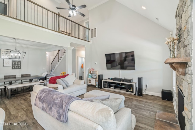 9337 Sandy Springs Ln, Knoxville, TN 37922 - living area featuring high vaulted ceiling, stairs, wood finished floors, a stone fireplace, and ceiling fan