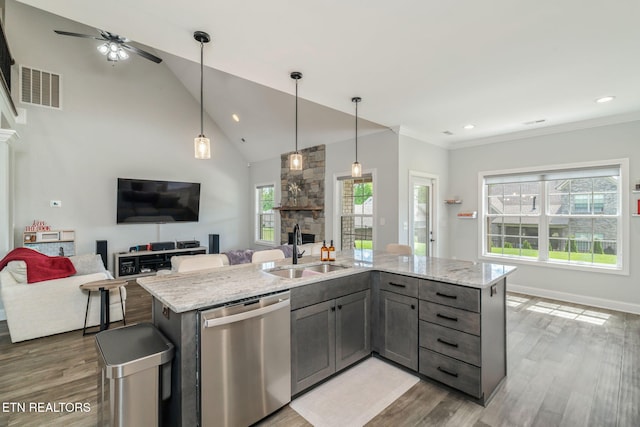 9337 Sandy Springs Ln, Knoxville, TN 37922 - kitchen with stainless steel dishwasher, a sink, wood finished floors, open floor plan, and recessed lighting