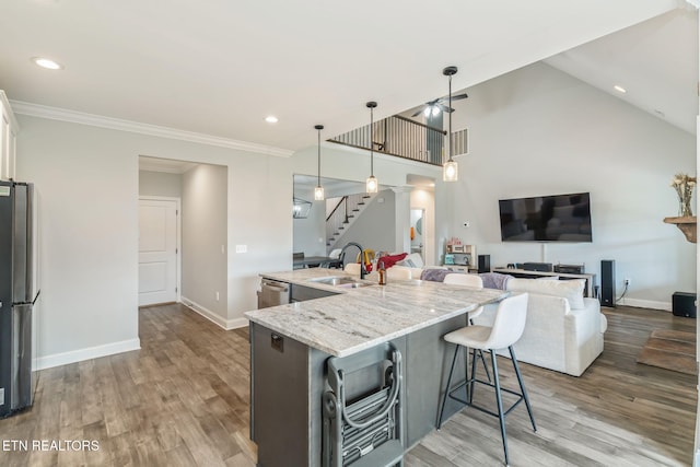 9337 Sandy Springs Ln, Knoxville, TN 37922 - kitchen with a sink, stainless steel appliances, wood finished floors, baseboards, and crown molding