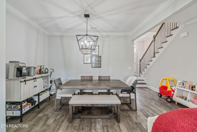 9337 Sandy Springs Ln, Knoxville, TN 37922 - dining space featuring wood finished floors, stairs, crown molding, a chandelier, and baseboards