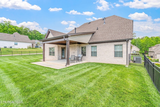 9337 Sandy Springs Ln, Knoxville, TN 37922 - back of house with brick siding, a patio, and roof with shingles