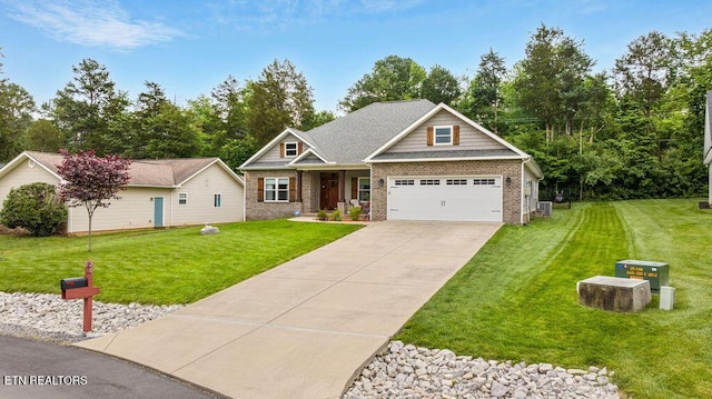 craftsman house featuring a front yard, brick siding, concrete driveway, covered porch, and a garage