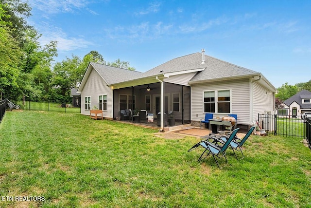 rear view of property with a ceiling fan, a patio area, and roof with shingles
