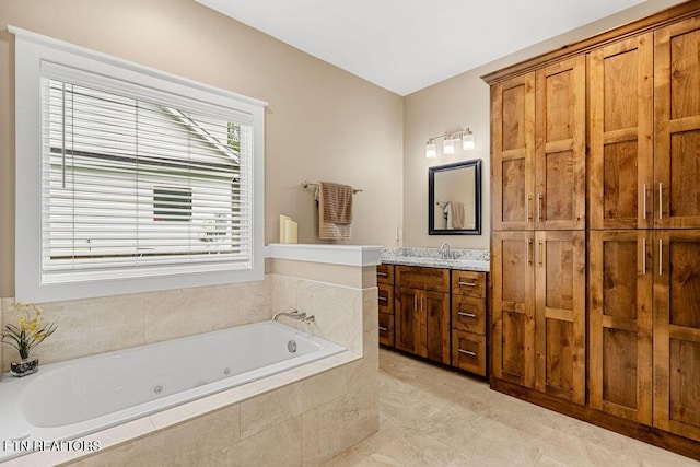 bathroom with a jetted tub and vanity