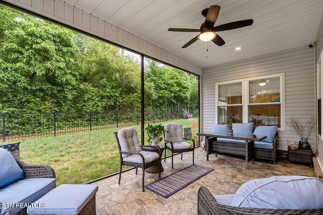 view of patio with an outdoor living space and ceiling fan