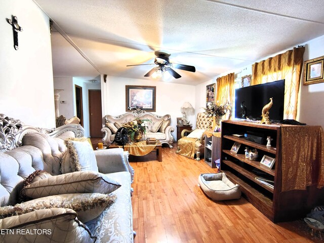 3497 Whittaker Rd, Cookeville, TN 38506 - living area featuring ceiling fan, wood finished floors, and a textured ceiling