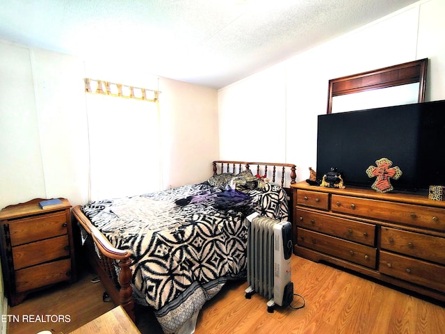 3497 Whittaker Rd, Cookeville, TN 38506 - bedroom featuring radiator and wood finished floors