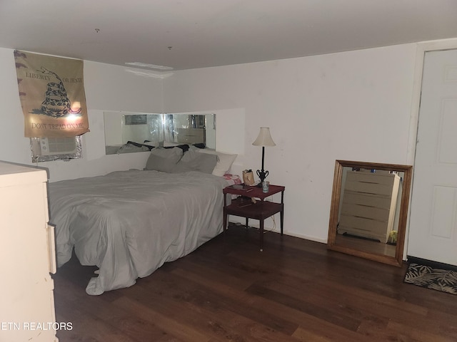 bedroom featuring wood finished floors