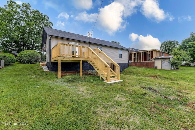 911 Valley Vista Dr, Loudon, TN 37774 - rear view of house with stairway, a deck, a lawn, central AC, and a storage shed