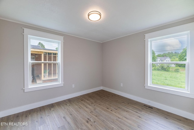 911 Valley Vista Dr, Loudon, TN 37774 - spare room featuring crown molding, wood finished floors, and baseboards