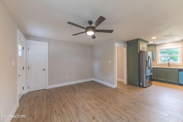 911 Valley Vista Dr, Loudon, TN 37774 - unfurnished living room with light wood finished floors, baseboards, ceiling fan, a sink, and recessed lighting