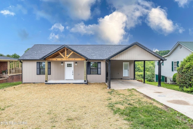 911 Valley Vista Dr, Loudon, TN 37774 - view of front of home featuring concrete driveway, a front lawn, central air condition unit, covered porch, and a carport
