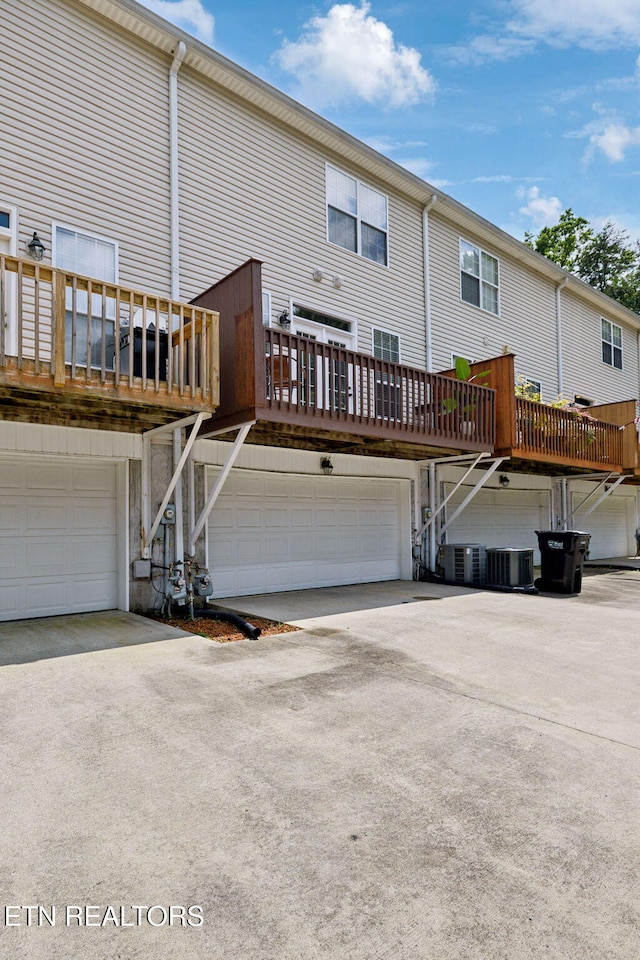 10737 Prince Albert Way, Knoxville, TN 37934 - back of house featuring a garage, stairway, central air condition unit, and driveway