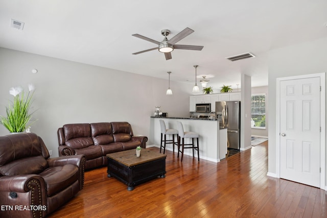 10737 Prince Albert Way, Knoxville, TN 37934 - living area featuring ceiling fan, dark wood-type flooring, and baseboards