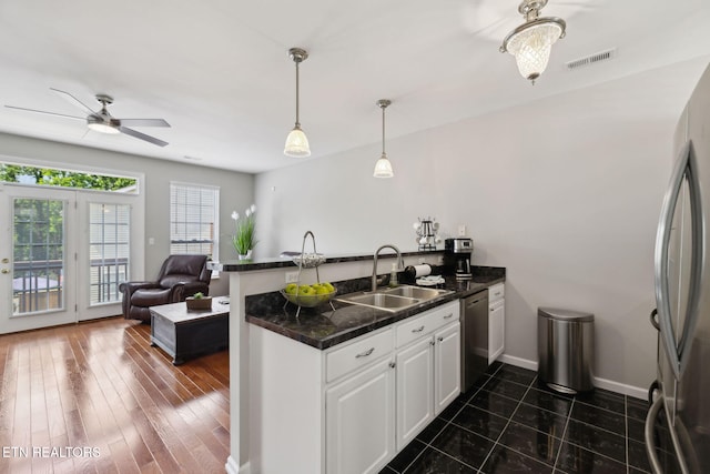 10737 Prince Albert Way, Knoxville, TN 37934 - kitchen featuring a sink, a peninsula, stainless steel appliances, white cabinetry, and open floor plan