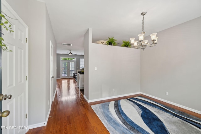 10737 Prince Albert Way, Knoxville, TN 37934 - foyer featuring wood finished floors, a chandelier, baseboards, and ceiling fan