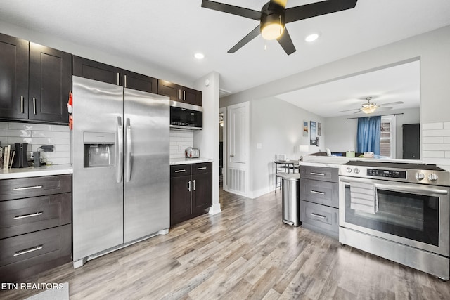 2007 NE Albert Ave, Knoxville, TN 37917 - kitchen with stainless steel appliances, a ceiling fan, backsplash, light countertops, and recessed lighting