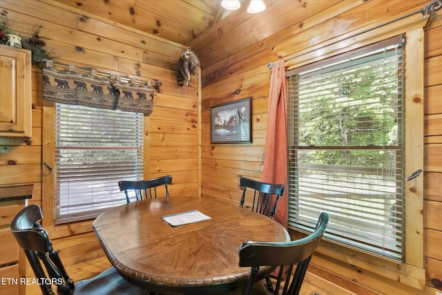 dining area with wood walls
