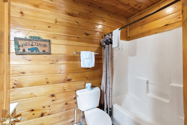 bathroom featuring wooden ceiling, toilet, wood walls, and shower / bath combo