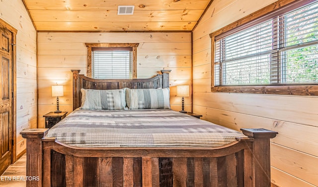bedroom featuring wood walls, lofted ceiling, and wood ceiling