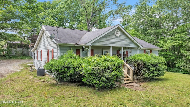 401 Offutt Spur Rd, Rocky Top, TN 37769 - ranch-style home featuring a front lawn, covered porch, central air condition unit, and roof with shingles