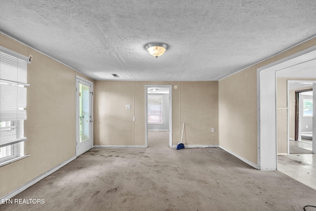 401 Offutt Spur Rd, Rocky Top, TN 37769 - unfurnished room featuring baseboards and a textured ceiling