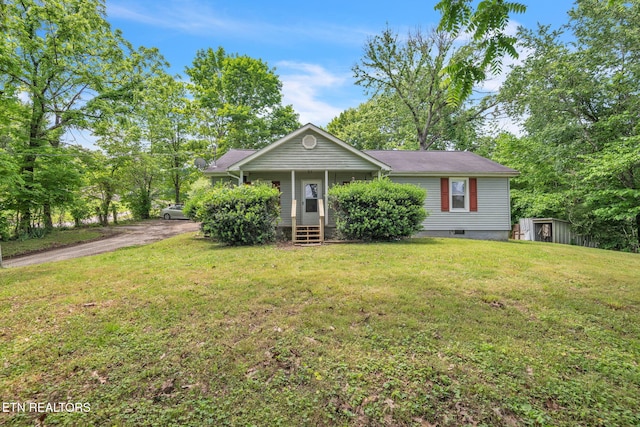 401 Offutt Spur Rd, Rocky Top, TN 37769 - view of front of property with a storage unit, a front yard, and an outbuilding