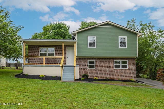 7513 Inverrary Cir, Knoxville, TN 37918 - split level home featuring brick siding, a front lawn, and covered porch