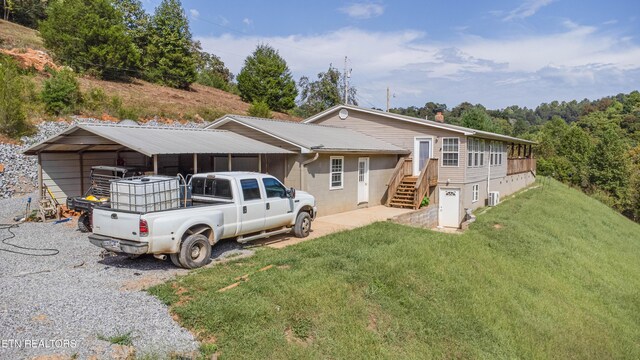 1418 Gulley River Rd, Harrogate, TN 37752 - view of front of home with a front lawn and a carport