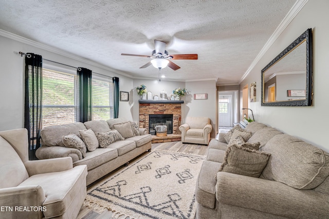 1418 Gulley River Rd, Harrogate, TN 37752 - living area with ceiling fan, wood finished floors, a textured ceiling, a fireplace, and ornamental molding
