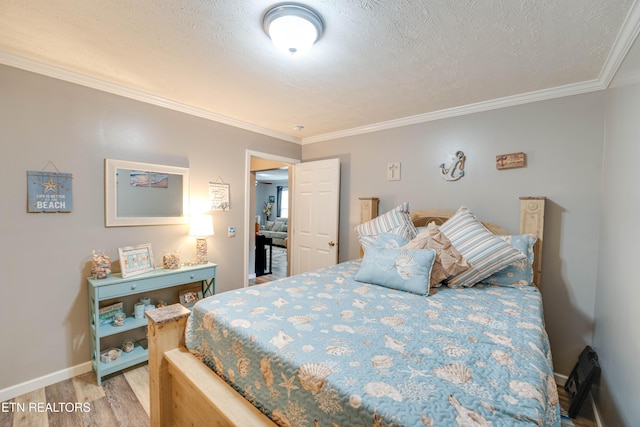 1418 Gulley River Rd, Harrogate, TN 37752 - bedroom featuring light wood-style flooring, crown molding, baseboards, and a textured ceiling
