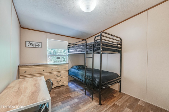 1418 Gulley River Rd, Harrogate, TN 37752 - bedroom featuring wood finished floors, a textured ceiling, and crown molding