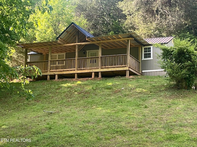 1418 Gulley River Rd, Harrogate, TN 37752 - view of front of home with a front yard, metal roof, and a wooden deck