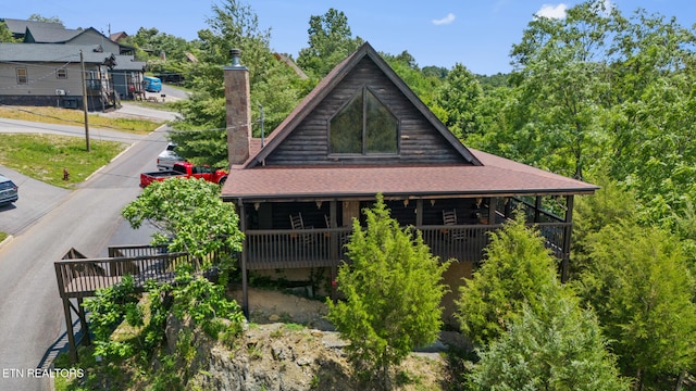 2028 Eagle Feather Dr, Sevierville, TN 37876 - back of house featuring a chimney and roof with shingles