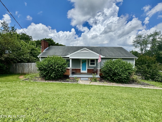 view of front of home featuring covered porch and a chimney