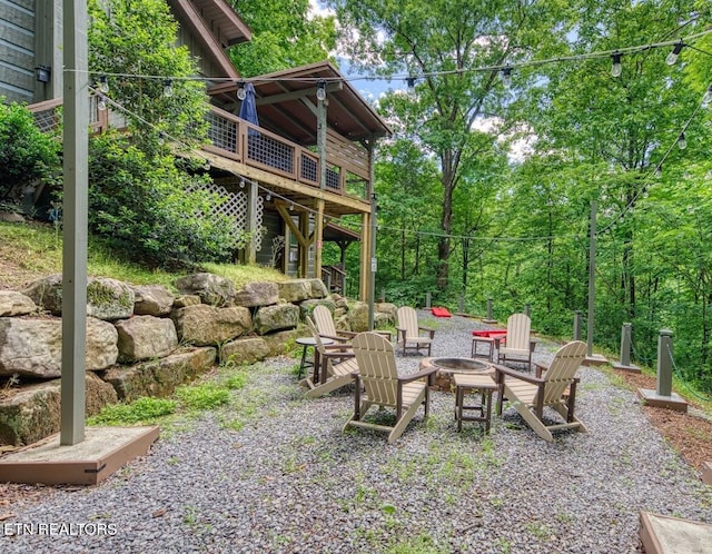410 Sassafras Trl, Sevierville, TN 37876 - view of patio / terrace featuring a fire pit and a wooden deck