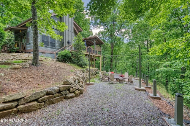 410 Sassafras Trl, Sevierville, TN 37876 - view of yard with a patio area, a wooden deck, and an outdoor fire pit