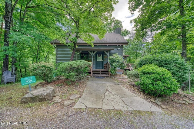 410 Sassafras Trl, Sevierville, TN 37876 - view of front facade with a chimney and covered porch