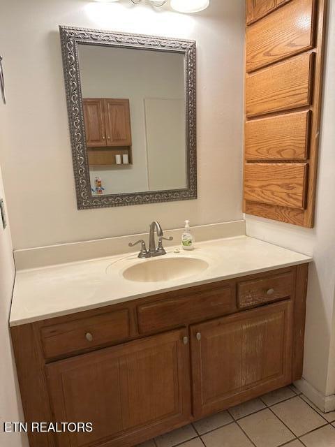 bathroom with vanity and tile patterned flooring