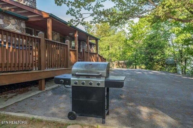 view of patio featuring a grill and a wooden deck