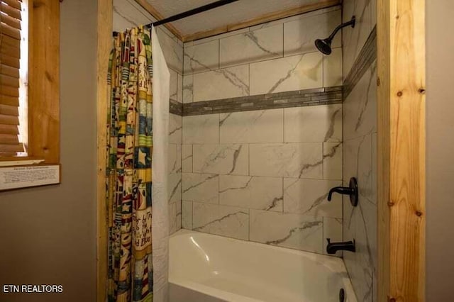 bathroom featuring shower / bath combination with curtain