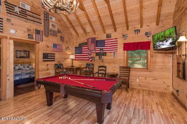 game room featuring wooden walls, wood ceiling, wood finished floors, pool table, and beamed ceiling