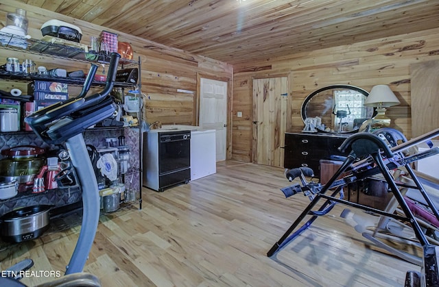 workout area featuring wood finished floors, wooden walls, and wood ceiling