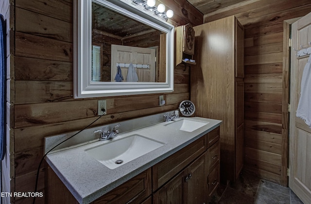 bathroom featuring wooden walls, double vanity, and wooden ceiling