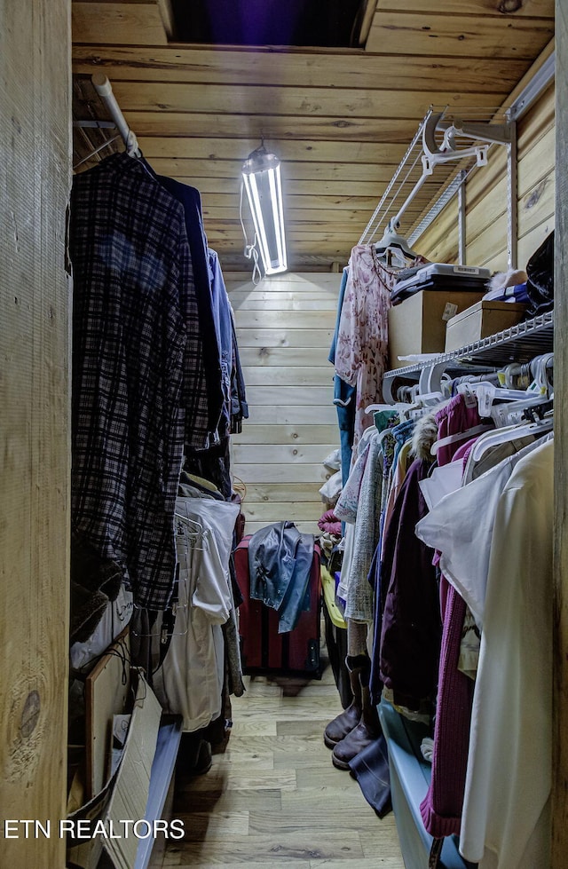 spacious closet featuring wood finished floors