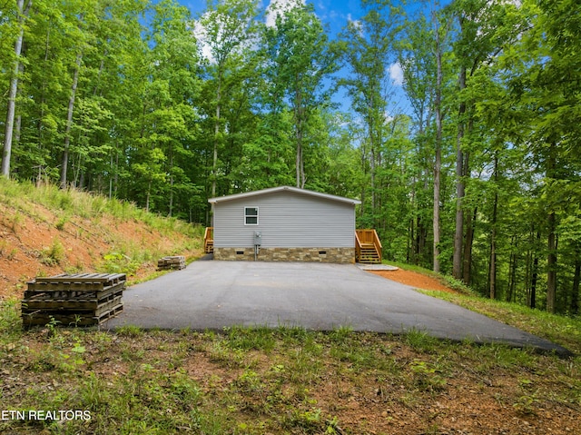 1452 Lower English Creek Rd, Newport, TN 37821 - garage featuring asphalt driveway and a forest view