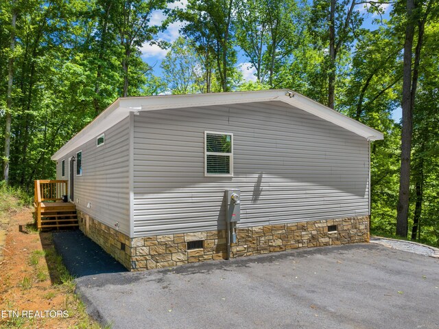 1452 Lower English Creek Rd, Newport, TN 37821 - view of side of property featuring crawl space and stone siding
