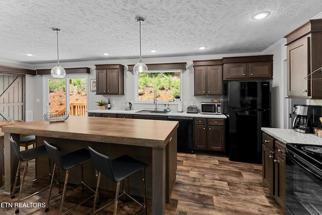 1452 Lower English Creek Rd, Newport, TN 37821 - kitchen with black appliances, crown molding, dark brown cabinetry, plenty of natural light, and a textured ceiling